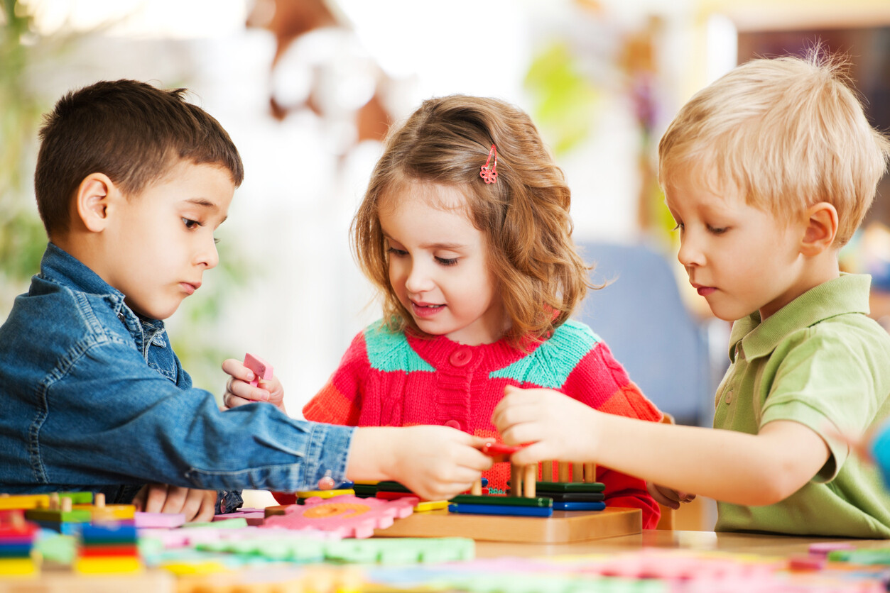 three young children playing a game