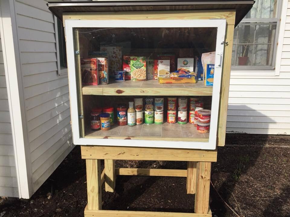 Little free pantry with two shelves of groceries